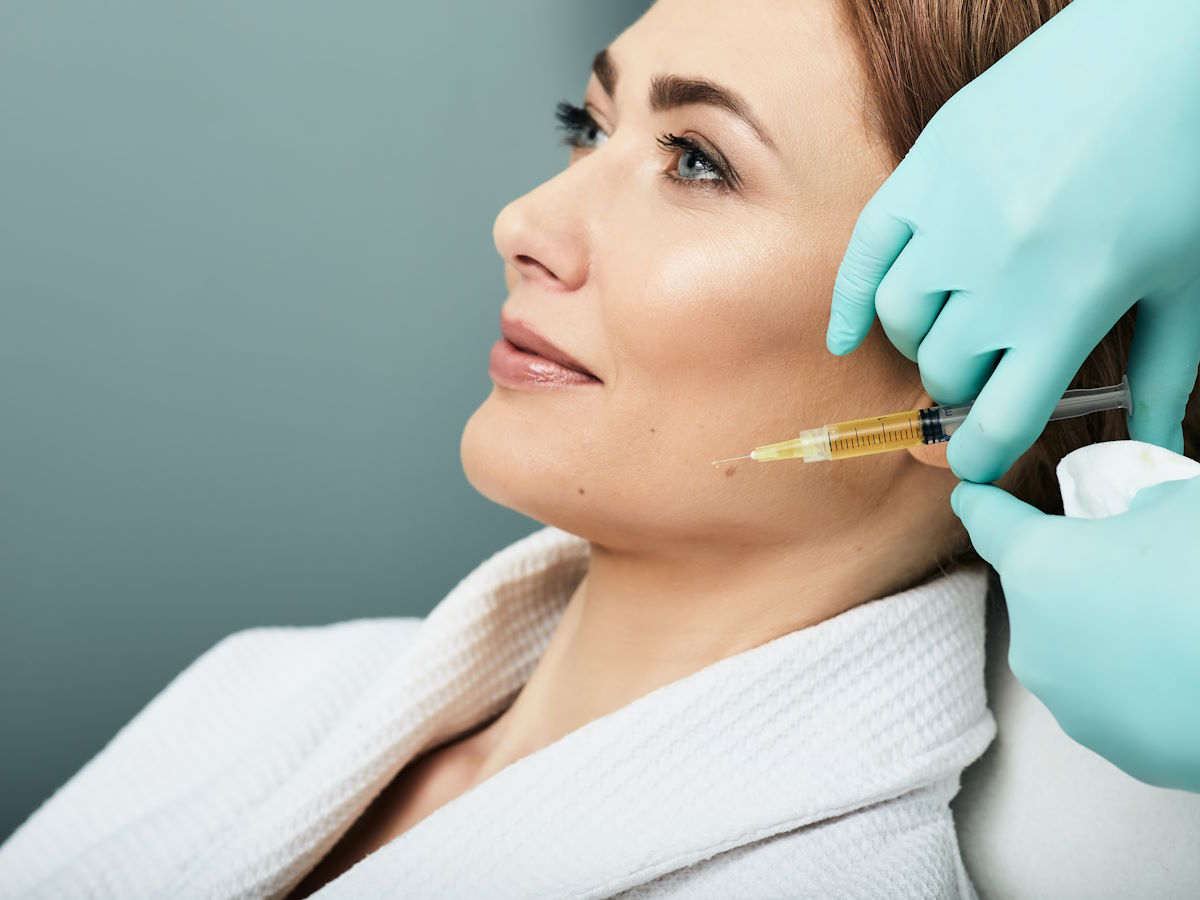 Plasmolifting injection, plasma therapy. Cosmetology procedure for woman's face skin using blood plasma